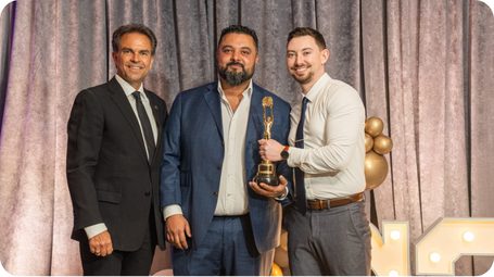 Bravo leadership accepting a CENTURY 21 Canada award