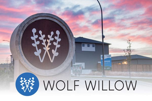 Wolf Willow community entrance signage at sunset